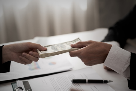 Handing money to someone